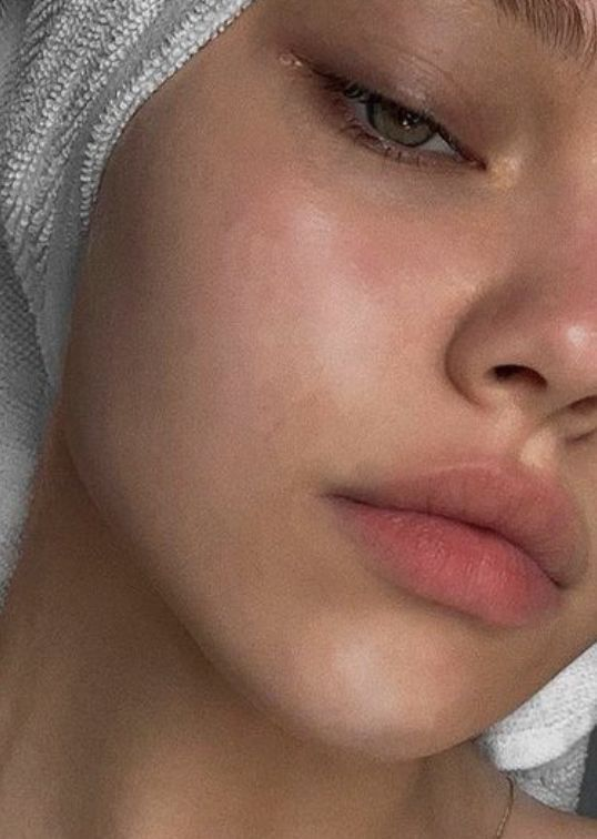 Close-up of healthy, balanced normal skin with smooth texture and natural glow after skincare routine .